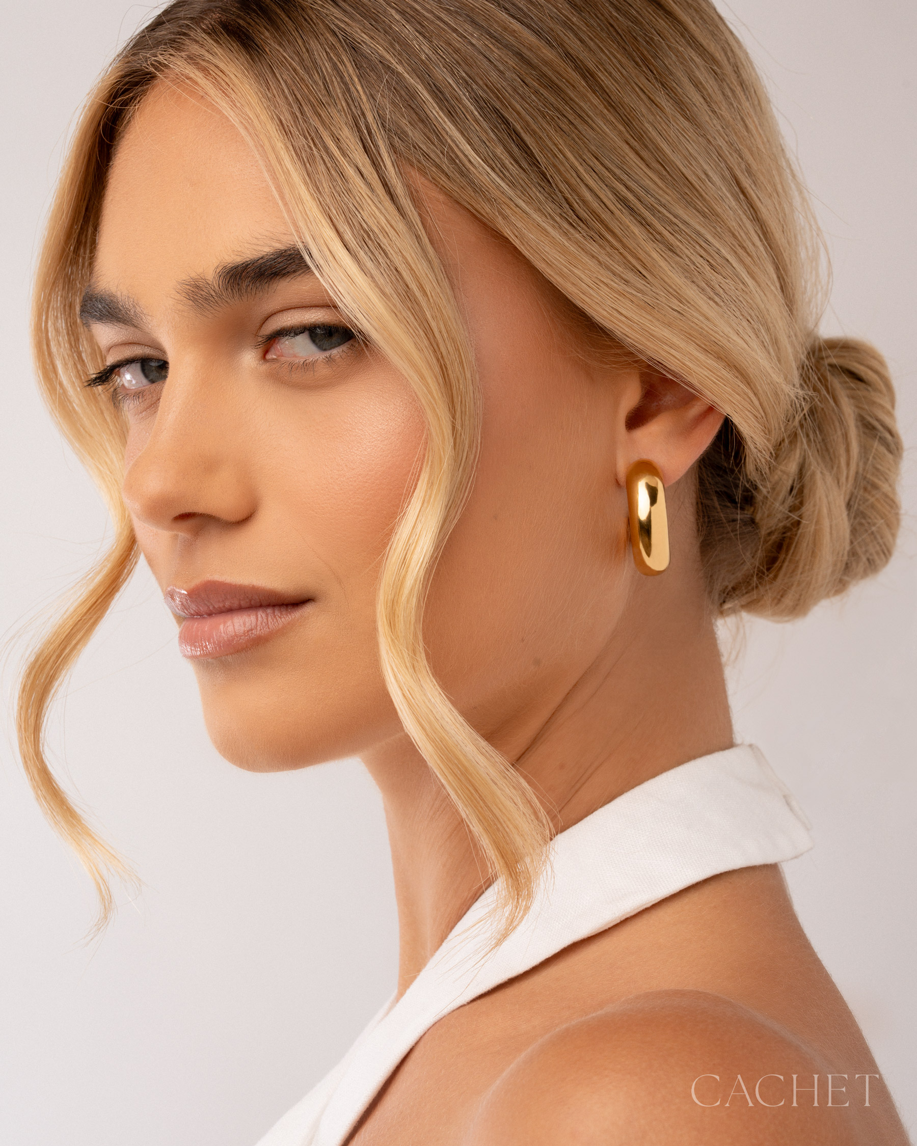 Gold Cachet jewelry worn by a model
